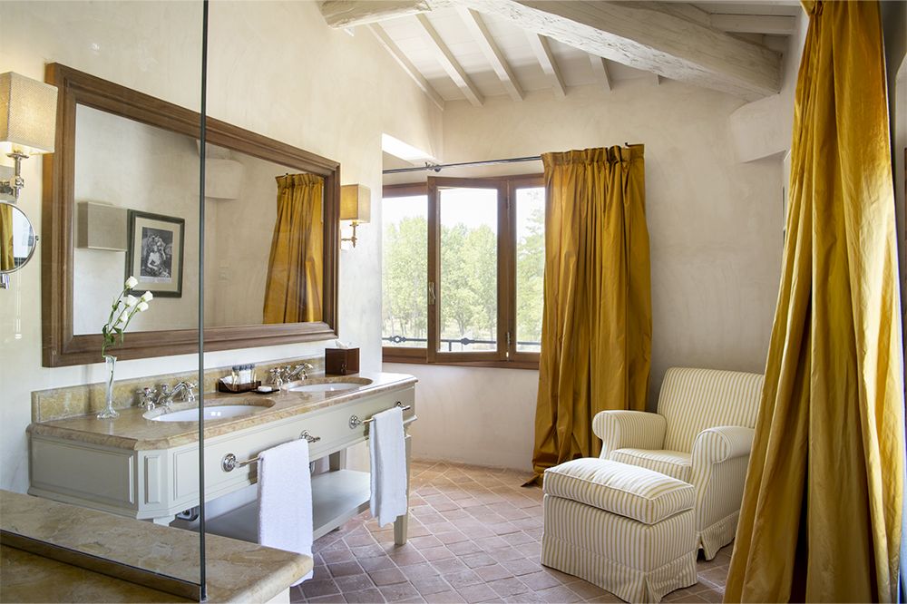 Bathroom with view of the luxury wedding resort in the Tuscan countryside