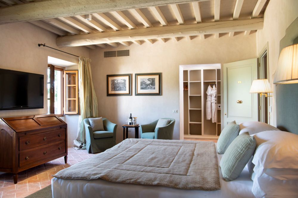 Bedroom with view at the luxury wedding resort in the Tuscan countryside