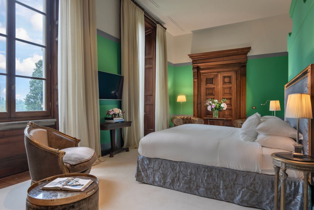 Blue and green bedroom at the luxurious wedding hotel in Florence