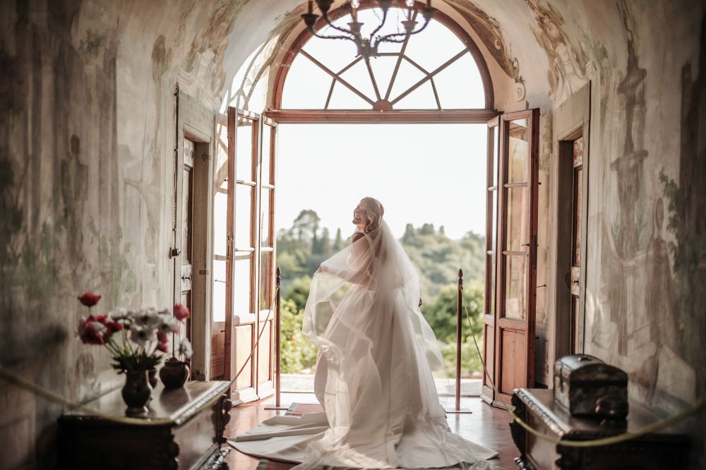 Bride under frescoes at the wedding rustic villa in Tuscany