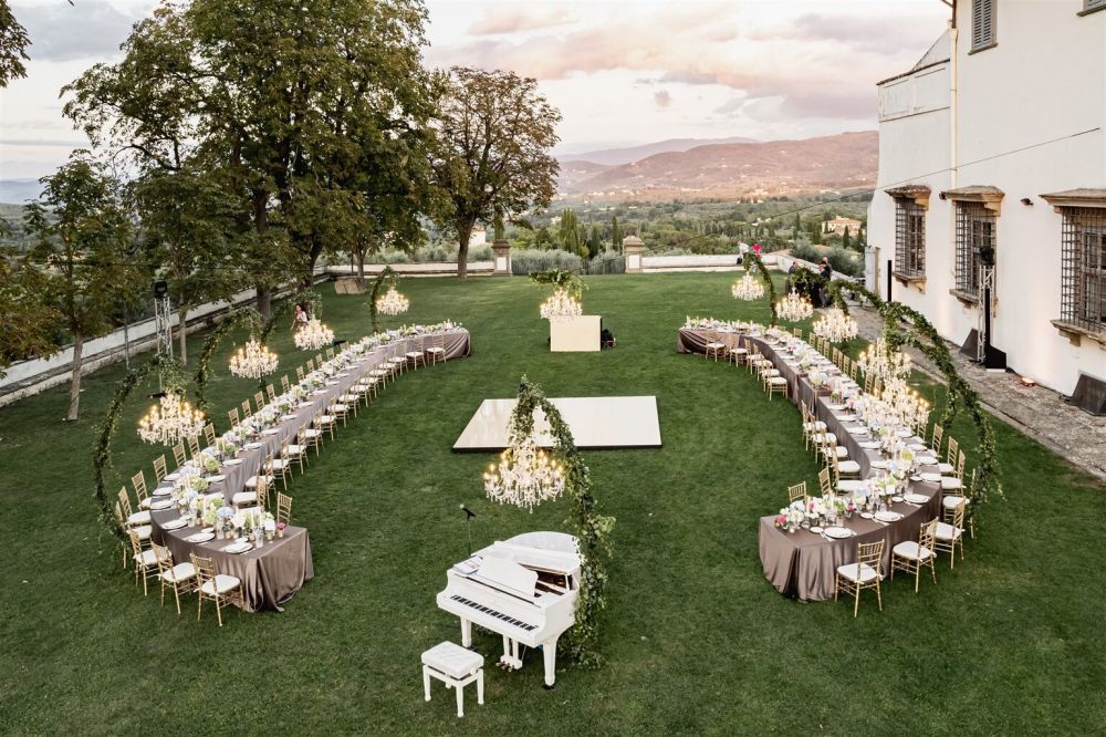 Dinner tables with piano at the wedding villa in Florence with view