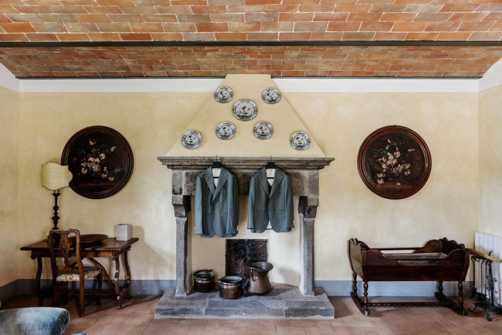 Fireplace with jackets at the romantic wedding farmhouse in Tuscany