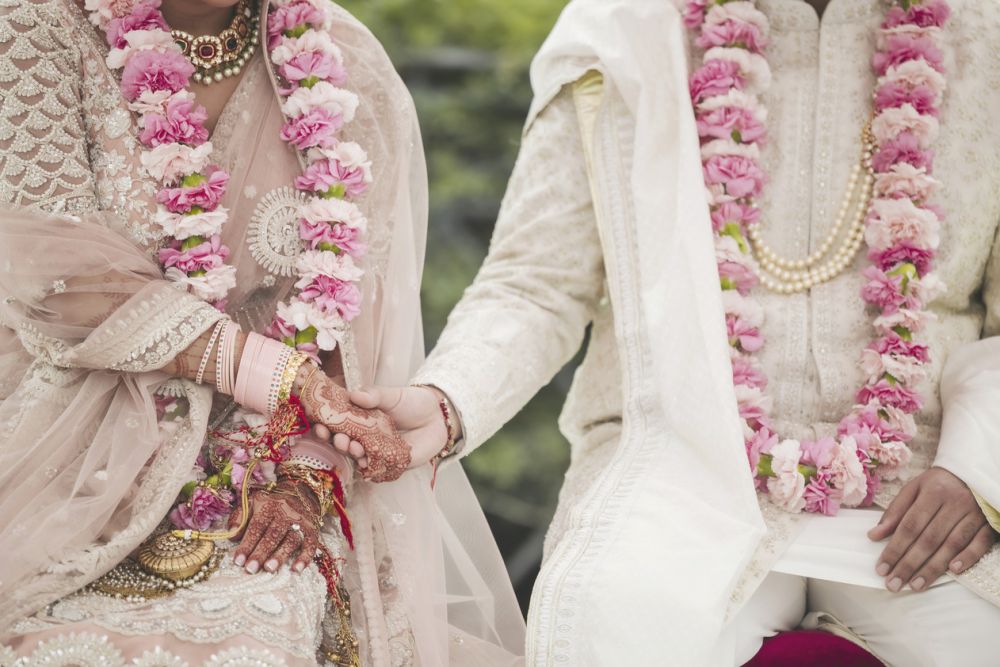 Indian bride and groom hand by hand