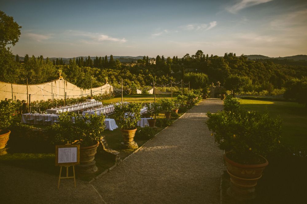 Long tables in the garden of the wedding rustic villa in Tuscany