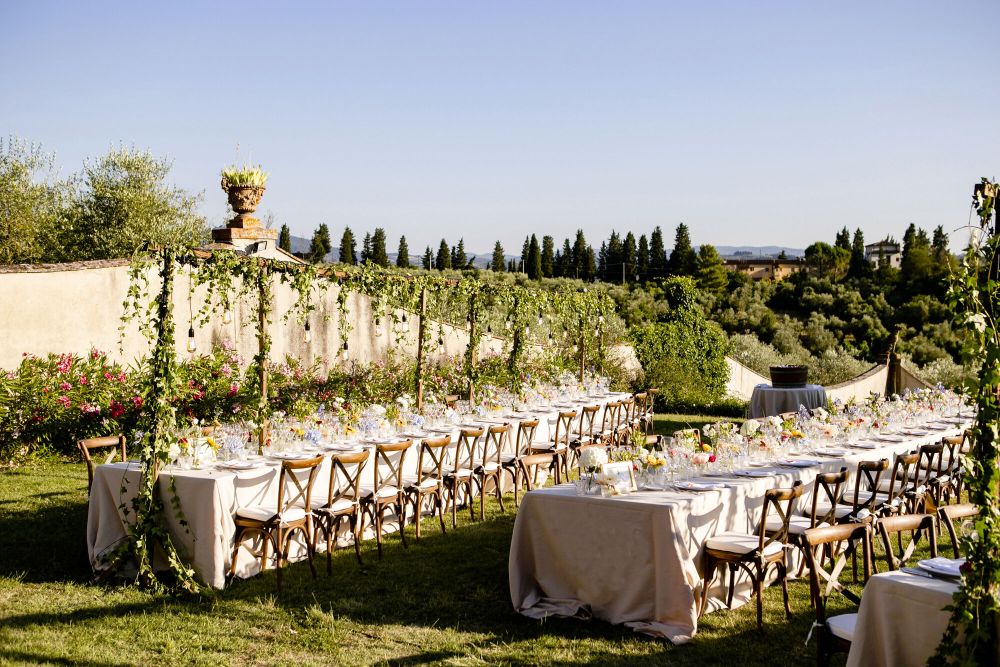 Long tables in the garden at the wedding rustic villa in Tuscany