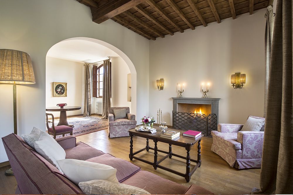 Pink living room with fireplace at the luxury wedding resort in the Tuscan countryside