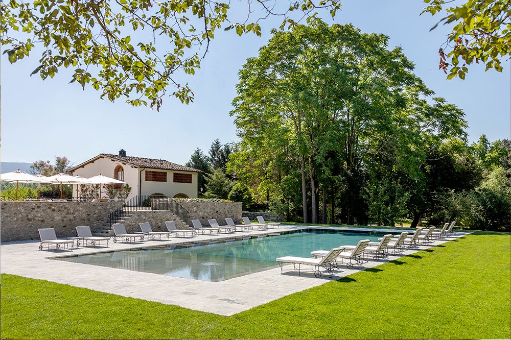 Pool with sun beds at the luxury wedding resort in the Tuscan countryside