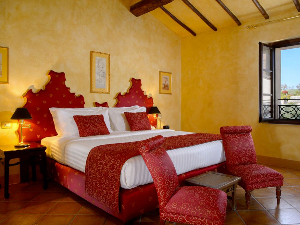 Red bedroom at the hamlet for wedding in Tuscany