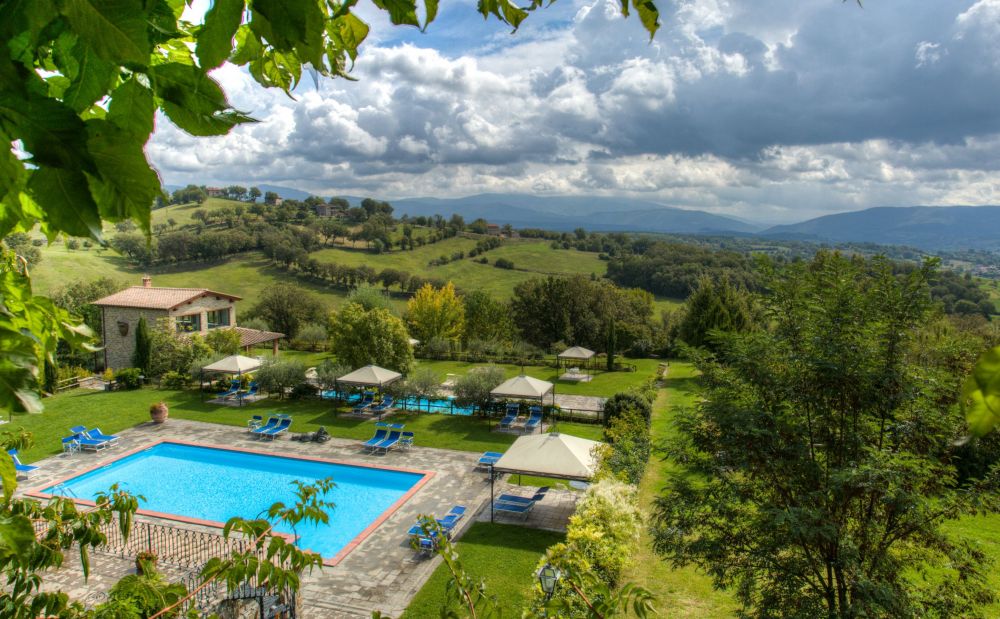 View of the pool and the countryside at the dream wedding hamlet in Tuscany