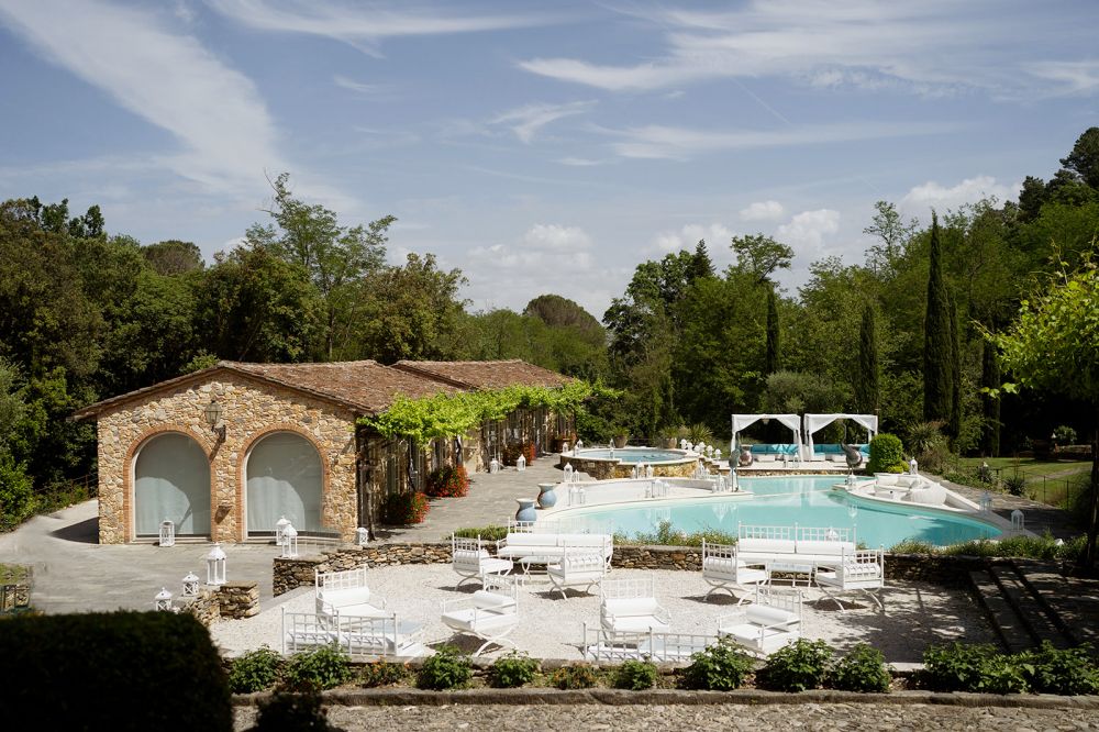 View of the pool and the venue and the Tuscan wedding hamlet