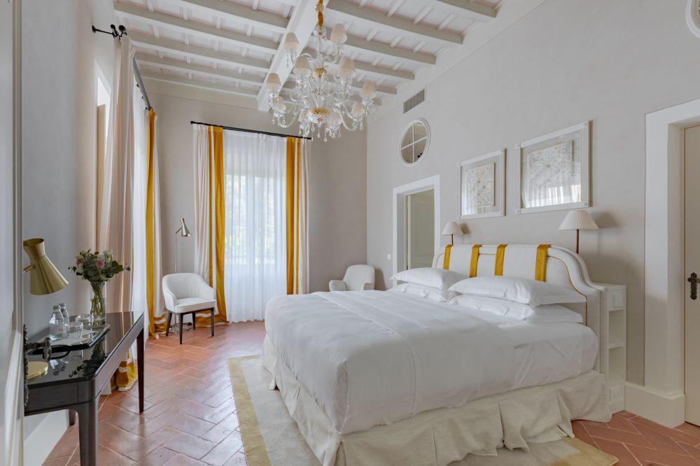 White and yellow bedroom at the villa in Florence for weddings