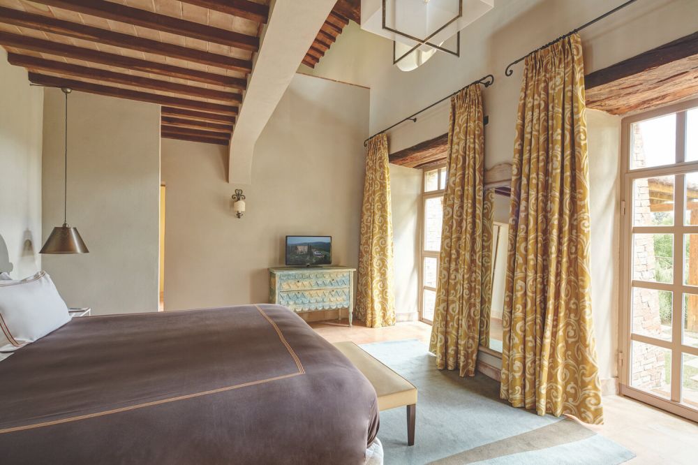 Yellow and purple bedroom at the San Gimignano wedding resort